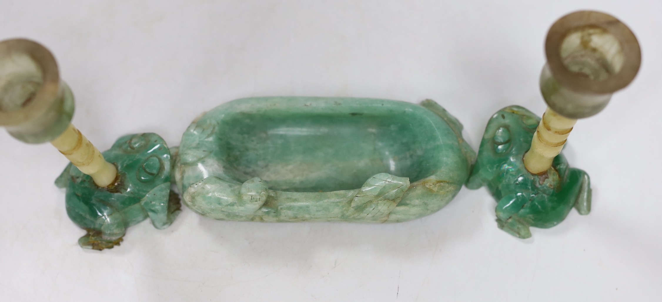 A pair of Chinese jade stemmed and green quartz candlesticks and a green quartz brushwasher, 12cms wide (3)